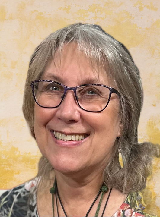 Karen wearing glasses with head tilted.